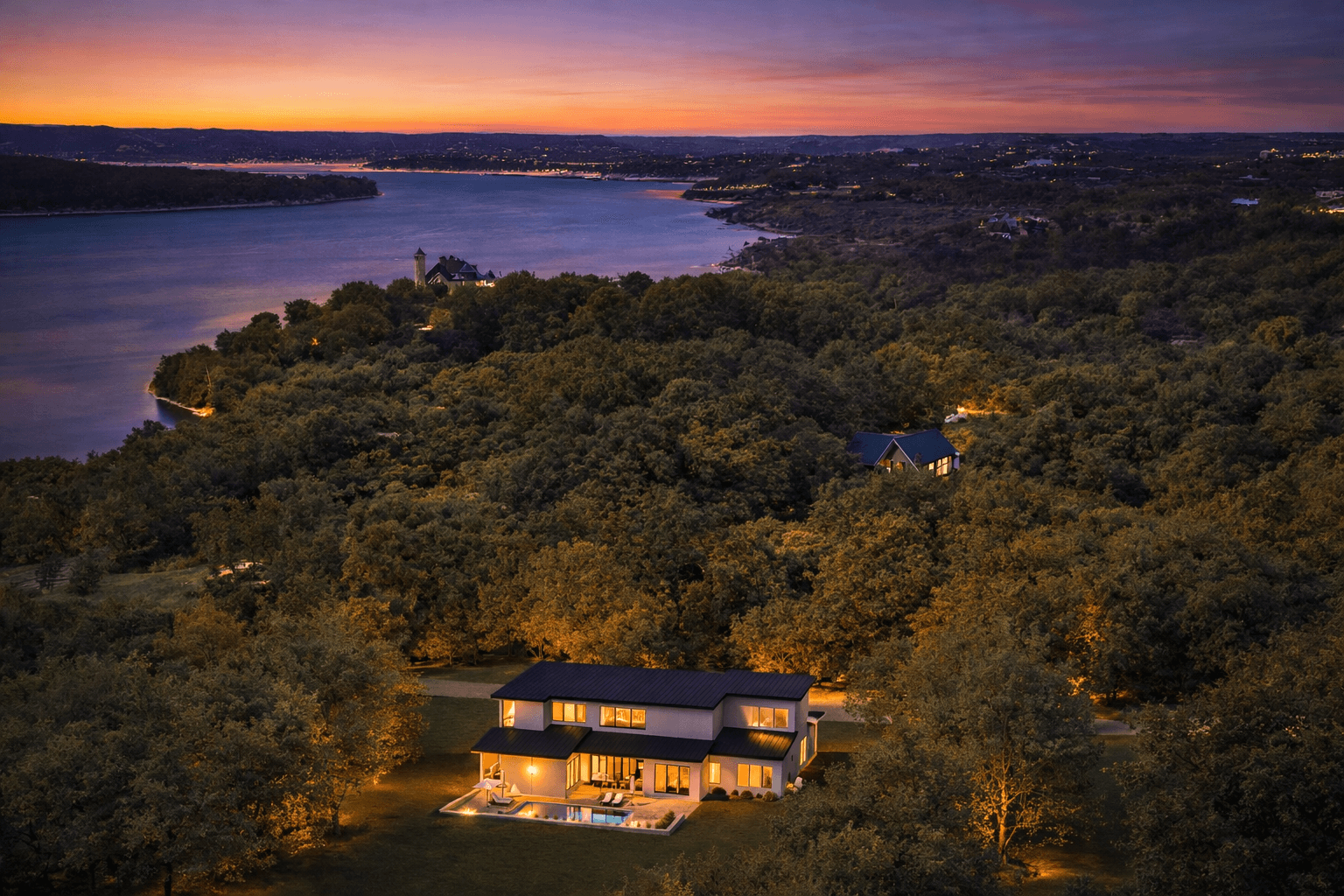 Aerial View of a Lakefront Luxury Custom Home on Lake Travis in Lago Vista, Texas at Dusk Aerial View of a Lakefront Luxury Custom Home on Lake Travis in Lago Vista, Texas at Dusk