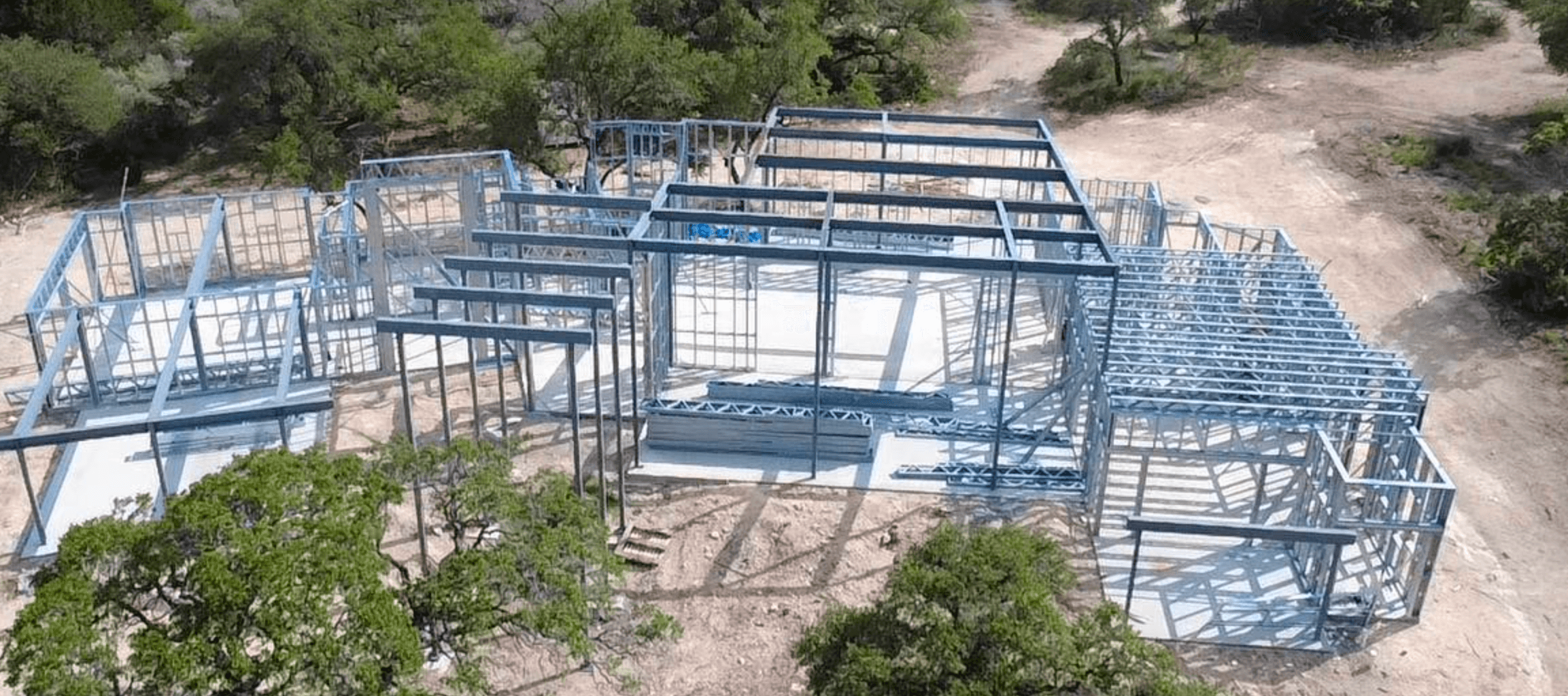 Light-Gauge Steel Frame of a Luxury Custom Home Under Construction in Texas – Aerial View Light-Gauge Steel Frame of a Luxury Custom Home Under Construction in Texas – Aerial View