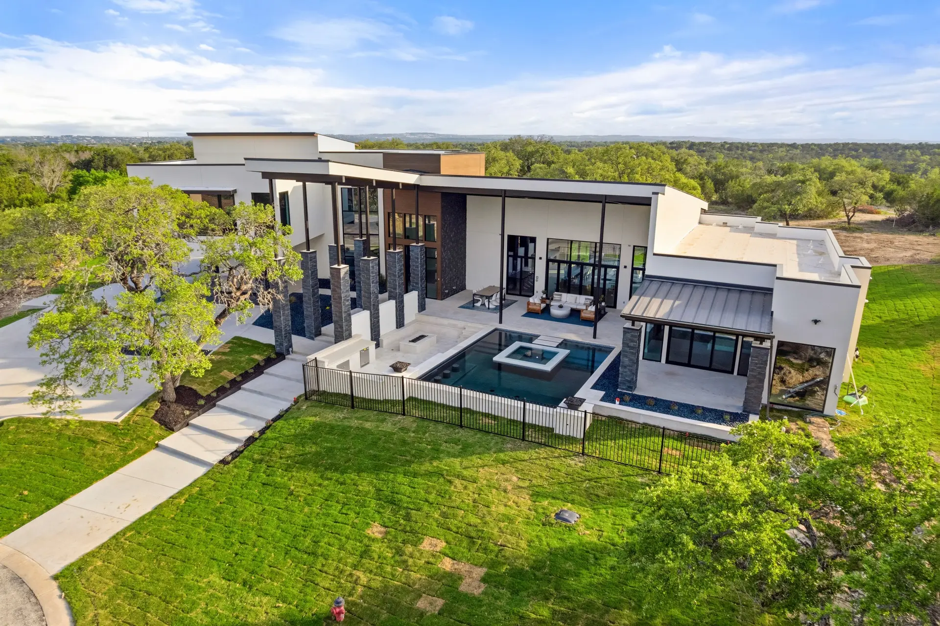 Bluewater Residence aerial view of rear pool, spa and covered patio in Lago Vista, Texas